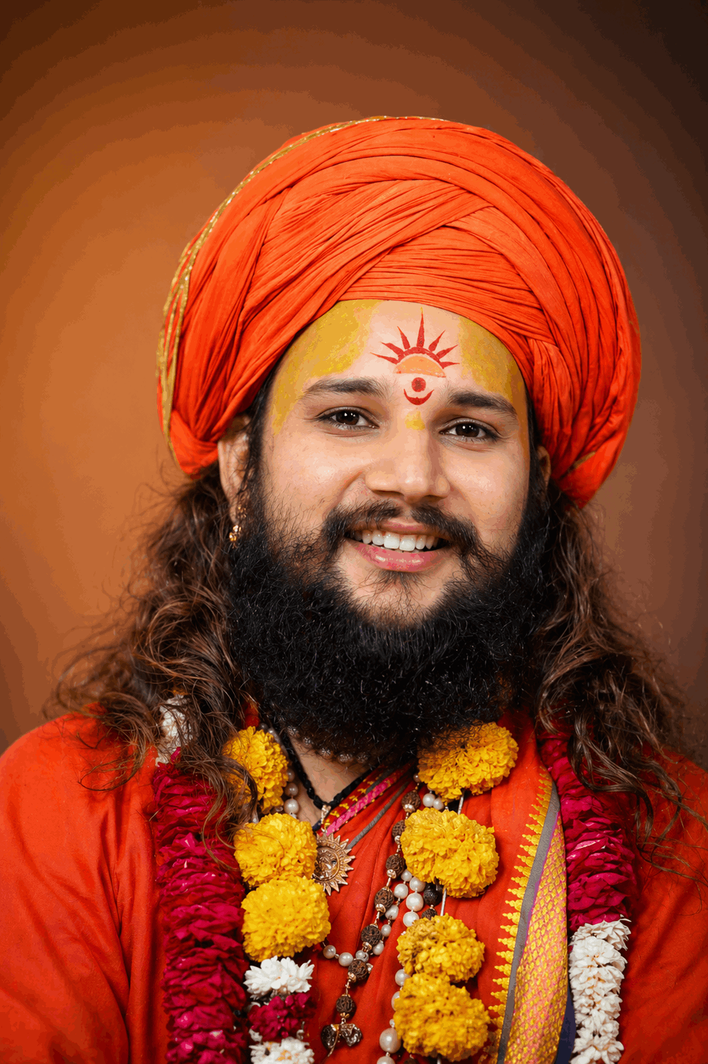 Maharaj Ji blessing devotees with raised hand and compassionate expression”